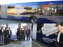 Foto vom Postauto in der billerbeck Folierung.