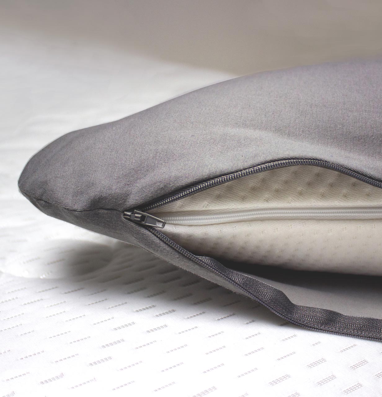Pillowcase for stomach sleeper pillow HEINZI Detailed view of the Heinzi cushion cover with open zip in grey